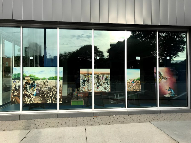Artwork by Jill Wells hanging in Ames Public Library's windows