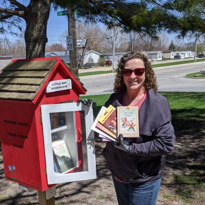 Sarah Refilling Little Free Library