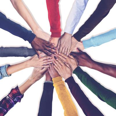 Many hands joined in center of image