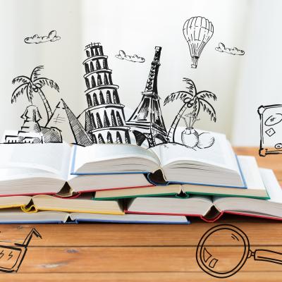 Photo of several books overlaid with illustrations of tourist destinations and travel icons