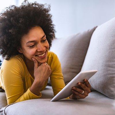Person reading an ebook on a couch