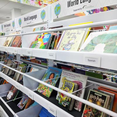 Shelves with children's books in Spanish and other languages
