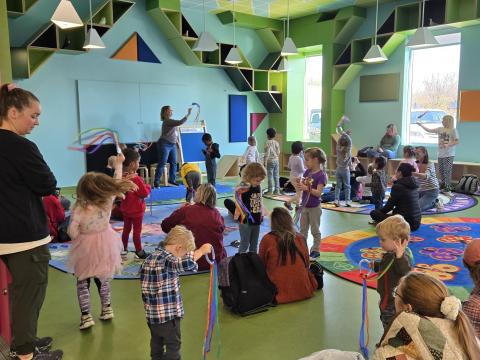 Photo of families having fun at storytime in Ames Public Library's Storytime Room