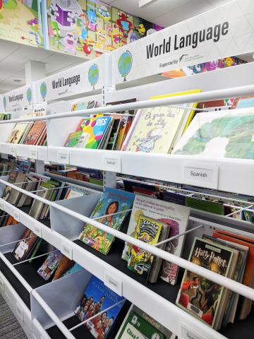 Shelves with children's books in Spanish and other languages